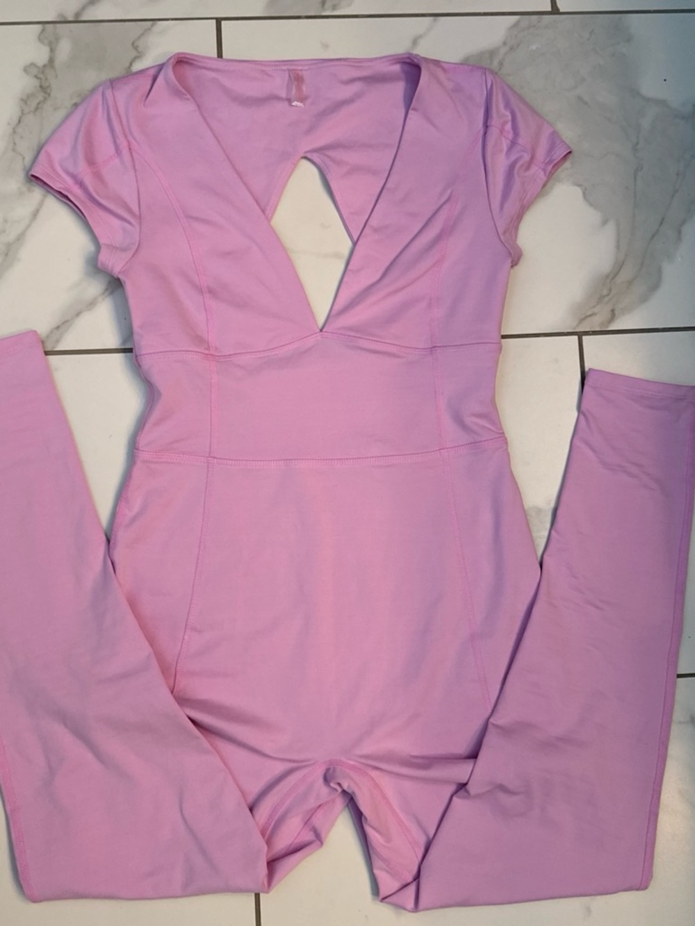 FREE PEOPLE MOVEMENT Pink bodysuit with cutout detail in back Size Small